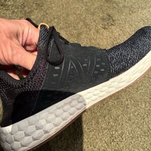 Women’s black New Balance sneakers